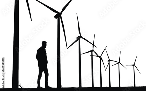 A lone man stands in awe before a row of towering wind turbines emphasizing scale and renewable energy
