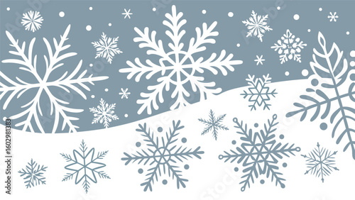 A beautiful winter landscape featuring a variety of large and small white snowflakes falling against a soft blue background with rolling white hills below