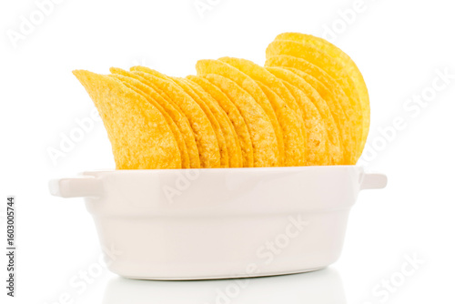 Crispy potato chips isolated on white background, close-up.