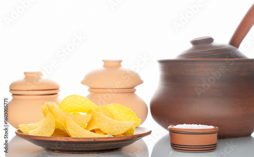 Crispy potato chips isolated on white background, close-up.