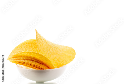 Crispy potato chips isolated on white background, close-up.