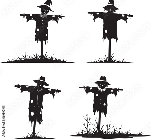 Four scarecrow silhouettes in a field silhouette