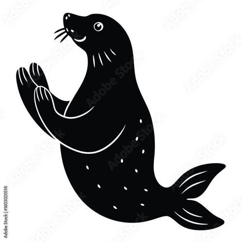 Cute black seal performing tricks with flippers raised