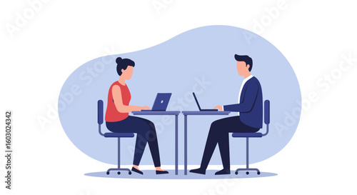 Two people working at desks on laptops in a modern office setting