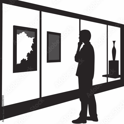 Contemplative art viewer standing in gallery silhouetted against white
