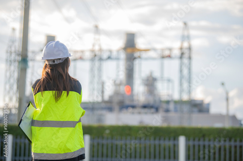 Tableau sur toile Asian man petrochemical engineer working at oil and gas refinery plant industry