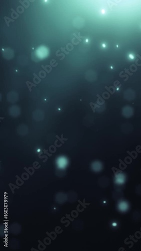 Underwater bubbles drift through shimmering blue water at night