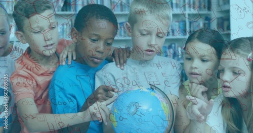 Children leaning over globe in library starting chemical formulas around group learning geography