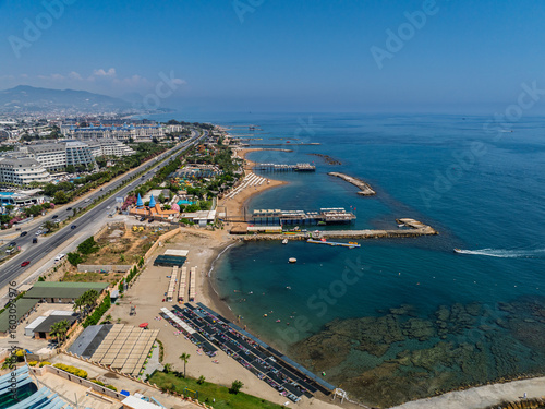 Stunning aerial day view over Turkler in Alanya, Turkey. Alanya coastline,resorts,marina,hotels and crystal clear turquoise water along the Mediterranean Sea. Mediterranean Sea turquoise coastline.