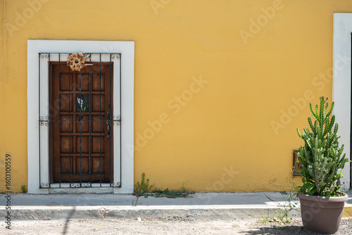 Entrance of a yellow house in Oaxaca, Oaxaca, Mexico