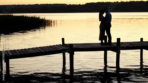 Couple on a dock at sunset