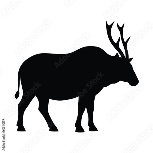 Silhouette of a majestic bull elk with large antlers standing