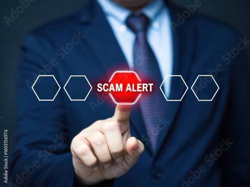 Businessman points to a digital screen displaying a scam alert warning