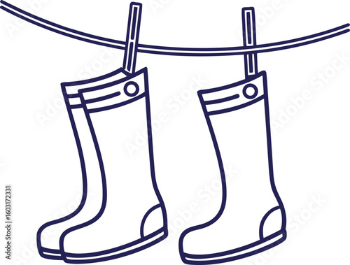 Two blue rubber boots hanging on a clothesline rain boots wellington boots