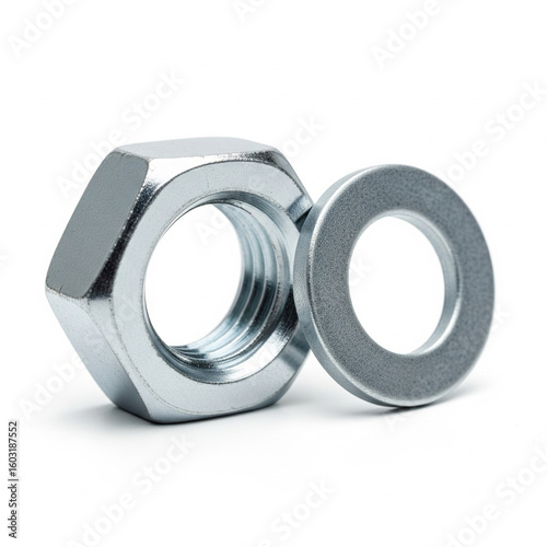A metal nut and washer isolated on white