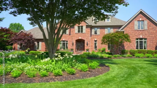 Wallpaper Mural Luxurious brick home with well-maintained landscaping Torontodigital.ca