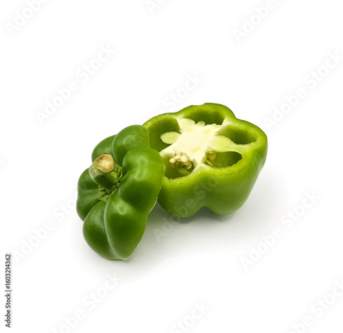 Fresh cut capsicum or, green bell peppers on white background. Whole and cut green bell peppers on white background, top view. high resolution salad image.
