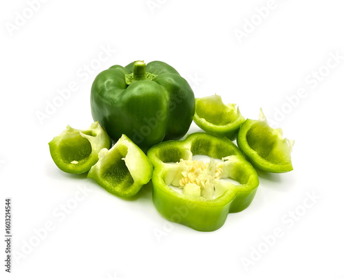 Fresh cut capsicum or, green bell peppers on white background. Whole and cut green bell peppers on white background, top view. high resolution salad image.