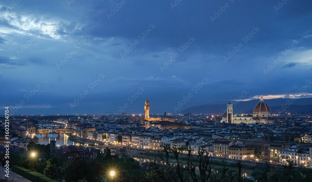 Obraz premium Panoramic evening view of the city of Florence in Italy from Piazzale Michelangelo and The sky is bright blue and the city is illuminated by lanterns.