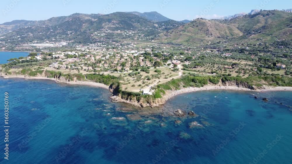 Coastal Aerial of Sette Frati – Rugged Nature and Crystal Waters Near Cefalù, Sicily Coastal Aerial of Sette Frati – Rugged Nature and Crystal Waters Near Cefalù, Sicily