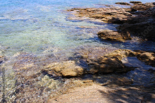 Fototapeta Naklejka Na Ścianę i Meble -  Rocky sea coast with clear turquoise ocean water, Murter, Croatia