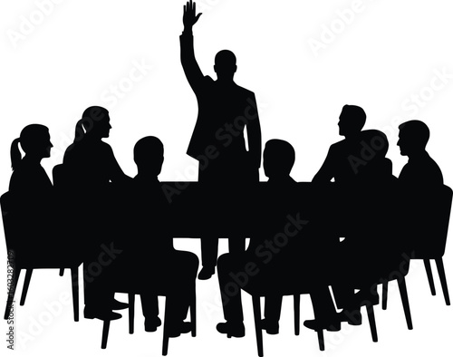 Silhouette of group meeting around table with one person raising hand in a meeting or conference room