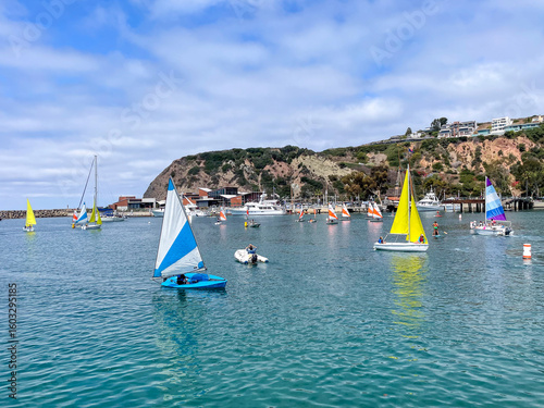 Dana Point, California, USA, July 16, 2025: Dana Point Harbor looking at sailboat in Baby Beach Cove