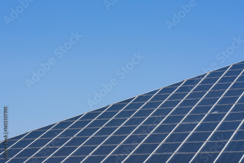 The symmetrical glass panels of an architectural structure