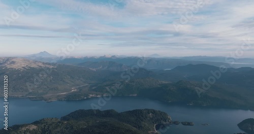 Aerial view of Villa Pehuenia with Lake Alumine and Andes Mountain Range in the distance. Neuquen, Patagonia, Argentina