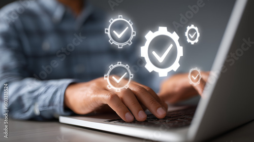 Workflow Efficiency: Hands typing on a laptop with futuristic visual representations of efficiency and optimization.