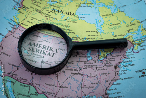 United States Of America on the world map, viewed through a magnifying glass, highlighting its location and significance