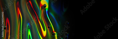 Horizontal Stripe of Rainbow Liquid Reflections on Black – Abstract Macro