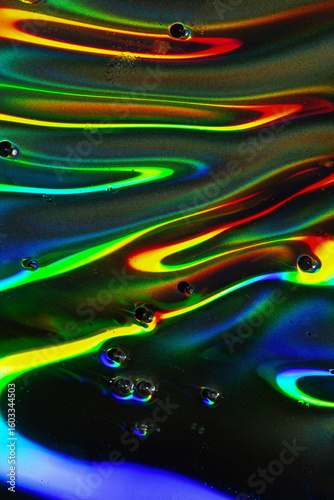 Vibrant Abstract Liquid Flow with Rainbow Refractions and Droplets
