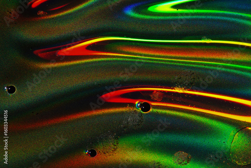 Colorful Wavy Liquid Macro with Red and Green Highlights on Rough Surface