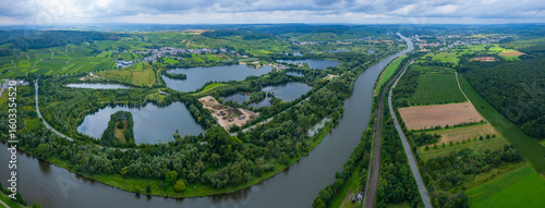 Aerial view of the village Remerschen and the river Mosel in Germany on a sunny spring day