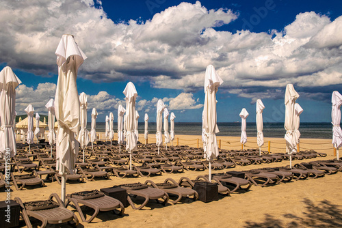 Fototapeta Naklejka Na Ścianę i Meble -  Sunny summer beach on the Baltic Sea in Sopot. Lounge chairs and parasols