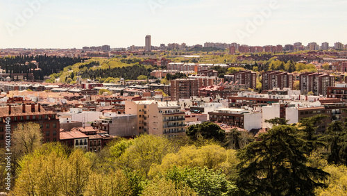 Partial view of the Casa de Campo neighborhood, Moncloa-Aravaca district and the trees of the Case de Campo park, the largest public park in the city of Madrid, Spain