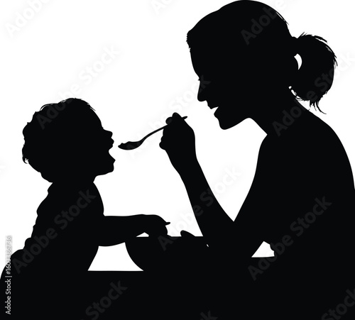 Silhouette illustration of a mother feeding her baby with a spoon during mealtime capturing a moment of nurturing and parenthood