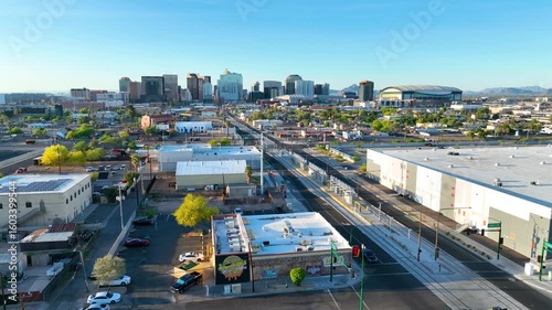 Aerial Downtown Phoenix Skyline Fly Over City Streets and Stadium Motion