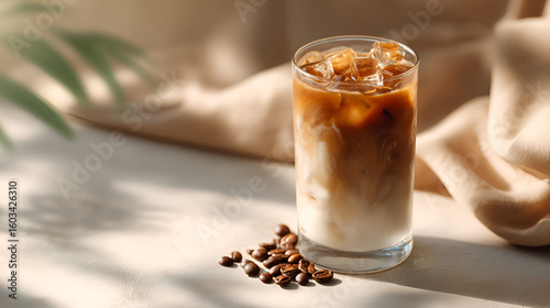 Iced coffee beverage with coffee beans and elegant neutral background for a refreshing and sophisticated look.