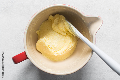 Top view of Creaming butter and sugar with a spatula, the process of making a cake or cookie