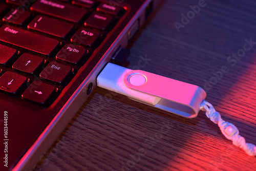 Obraz na plátne USB drive plugged into the side of a laptop