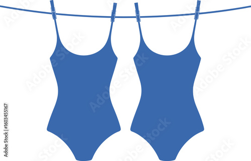 Two blue one piece swimsuits drying on a clothesline
