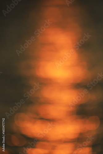 光の道をぼかしたオレンジの背景素材