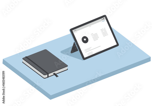A digital tablet and notebook are on a light blue surface