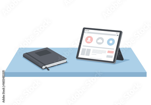 A tablet and a notebook rest on a light blue surface