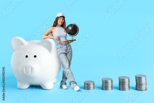 Piggy bank and stacks of co...