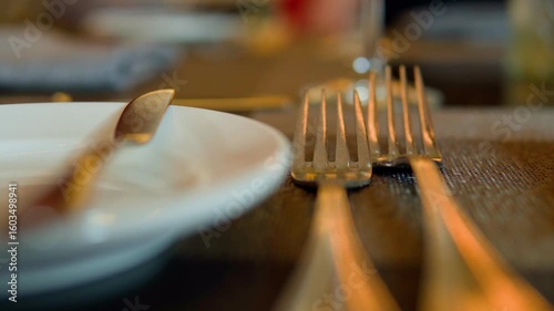 Elegant table setting with cutlery and plates ready for dining