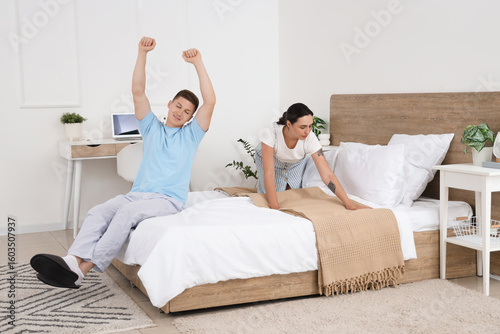 Wife making bed and her laz...