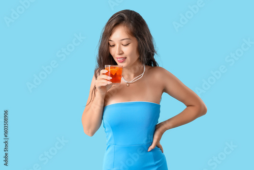 Young Asian woman with aper...